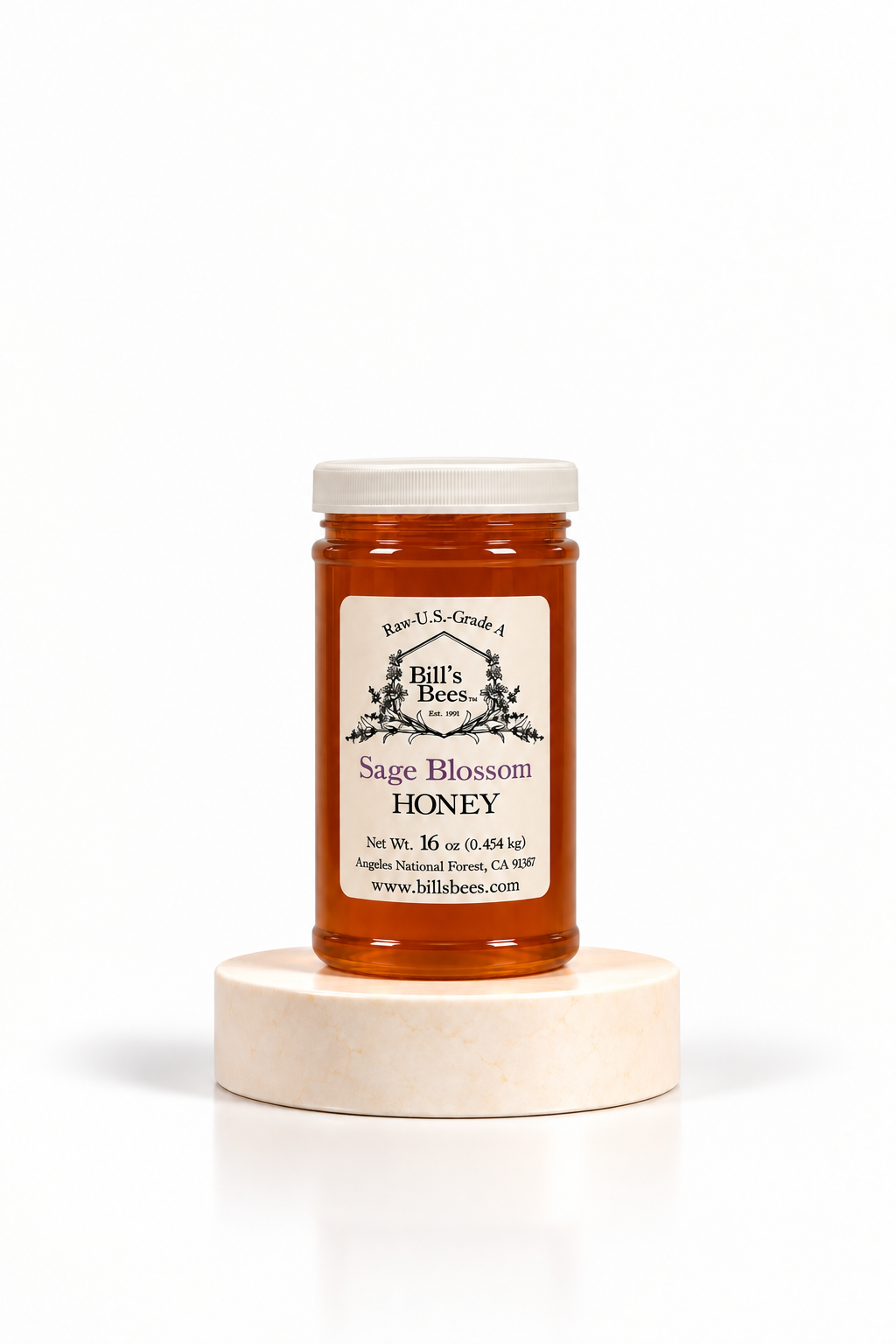 16 oz Bill's Bees Sage Blossom Honey jar on a marble pedestal, portrait format