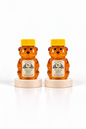 Two 2 oz Bill's Bees Wildflower Honey squeeze bears, portrait format