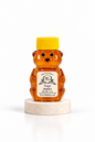 2 oz Bill's Bees Sage Blossom Honey squeeze bear on a marble pedestal, portrait format